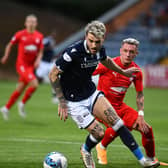 Callumn Morrison puts pressure on the Dundee defence (Photos: Michael Gillen)