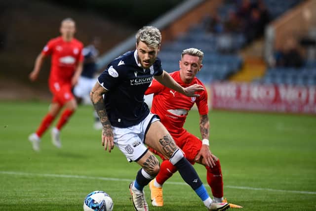 Callumn Morrison puts pressure on the Dundee defence (Photos: Michael Gillen)