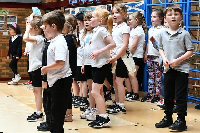 The primary 2 and primary 1 performance is going so well one young lad had time to acknowledge the Falkirk Herald photographer