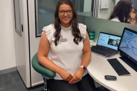 Claudia McCue, 22, is the company's youngest hearing director.  She works at the store on Falkirk High Street.