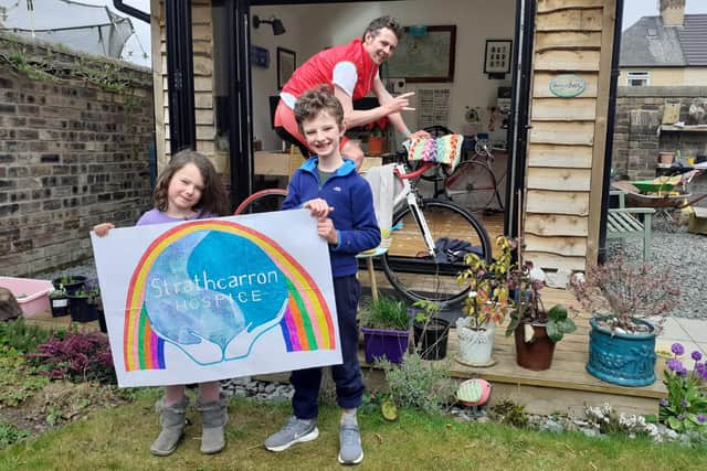 Barry Sturrock was cheered on by children Freya and Rory as he cycled 100 miles for Strathcarron Hospice