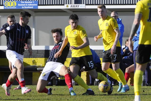 Steven Hetherington goes in for a tackle on a rare start for Falkirk