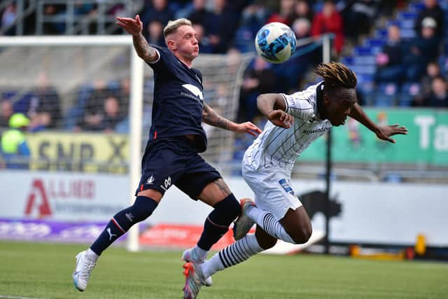 Callumn Morrison battles for possession up against Dunfermline's Ewan Otoo