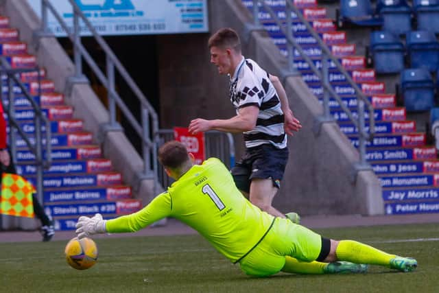 Shire's Kieran Offord rounds Chris Henry looking to score (Pictures: Scott Louden)