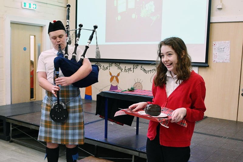 Piping in the Haggis are Connor and Carly B.