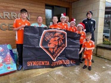 Syngenta Juveniles hand over gifts to Strathcarron Hospice