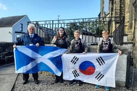 Councillor Billy Buchanan with Emma Harvey from Bonnybridge, Douglas and  Fraser MacPherson from Brightons, who will be representing Falkirk next year at the World Scout Jamboree in Korea.