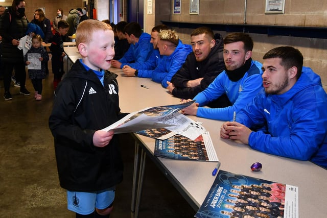 Players line up for a signing session afterwards