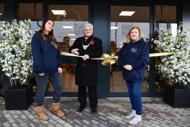 Provost Billy Buchanan opens the new shop as Aimee Hamilton and Irene Klapwijk look on
