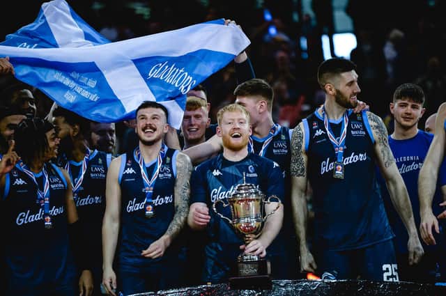Jonny Bunyan celebrates with the BBL trophy in hand after helping Caledonia Gladiators lift silverware (Photo: British Basketball League)