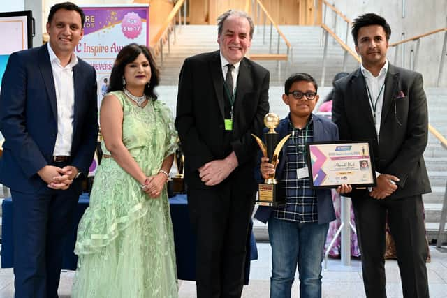 Aarush Naik, from Kinnaird Primary, received the Rubik's Hero award.  He is pictured with, from left, Anas Sarwar; Dr Rashmi Mantri (BYITC founder); Bill Buchanan (judge) and Kiran Sagar (Whitebridge Financial Services).  (Pic: British Youth International College)