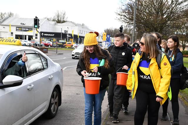 Pupils collected donations on their walk to the Helix as well as at the tourist spot