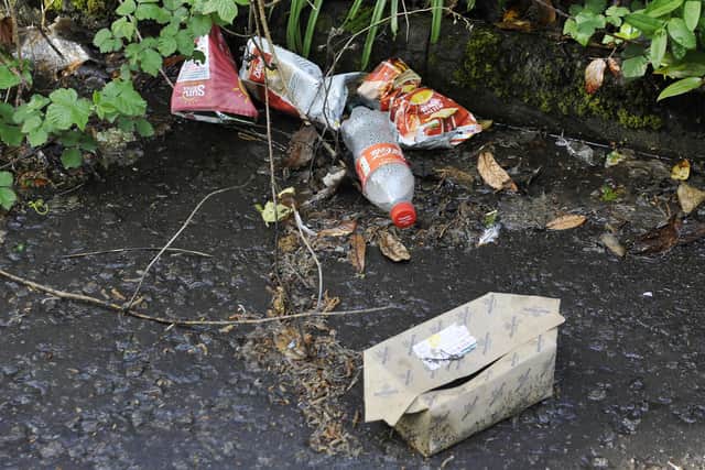 Litter on the path that runs from Morrisons to St Mungo's High School. (Pic: Michael Gillen)