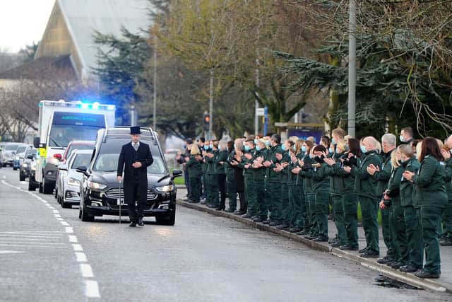 The funeral of Scottish Ambulance Service paramedic Rod Moore passed Falkirk Ambulance Station where colleagues and friends paid their respects. Pic: Michael Gillen