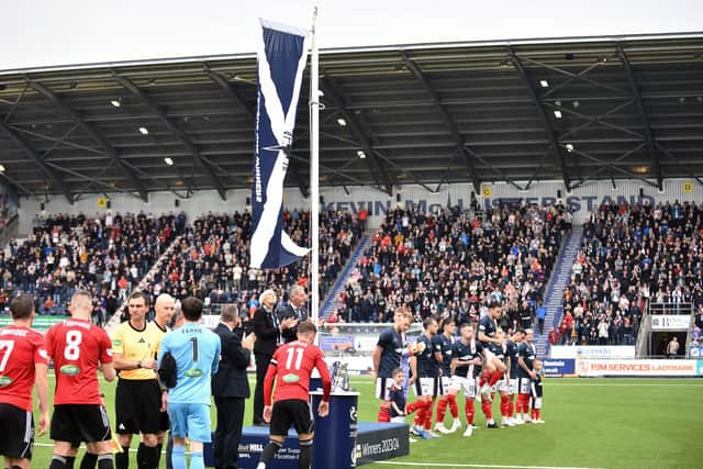 Falkirk raised the League One winners flag before their match against Queen's Park (Photo: Michael Gillen)