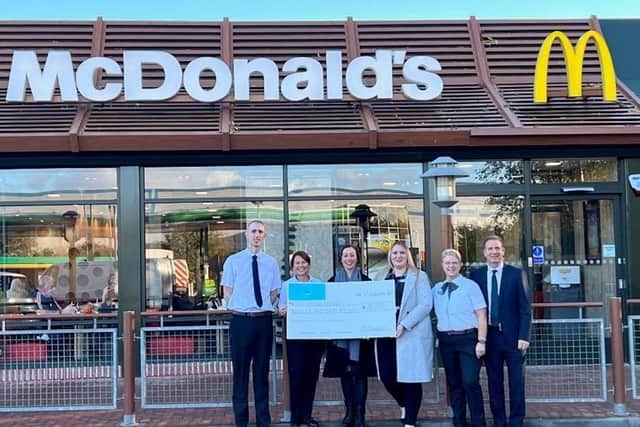 Franchisee Elliot Jardine, who runs the McDonald’s restaurants in Falkirk, Alloa and Stirling, handed over £20,000 to Strathcarron Hospice.