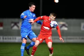 Max Kucheriavyi looks to control the ball under pressure from Kelty Hearts' Joe Cardle (Pictures by Michael Gillen)