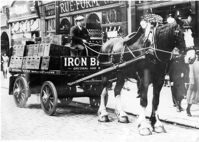 The mighty Clydesdale horse Carnera hard at work in Falkirk town centre back in the day