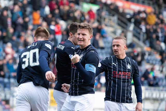 Watson gestures to the North Stand support after scoring (Picture: Ian Sneddon)