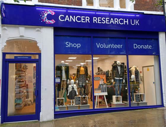 Cancer Research UK is re-opening its charity shops after being closed for three months