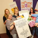 Social Justice Secretary Shirley-Anne Somerville, third left, talks baby boxes with Home-Start Falkirk. Pic: Scott Louden