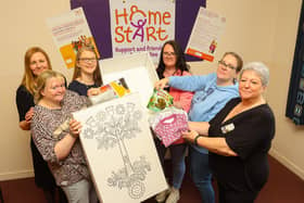 Social Justice Secretary Shirley-Anne Somerville, third left, talks baby boxes with Home-Start Falkirk. Pic: Scott Louden