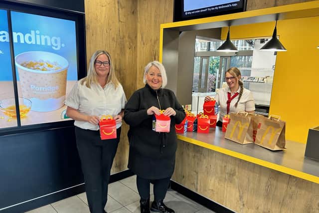 Michaela Tripney accepts the Happy meals from Falkirk McDonalds on behalf of Bowhouse Community Association
(Picture: Submitted)