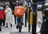 A delivery rider on an e-bike on a pavement in Glasgow city centre. (Pic. John Devlin.)