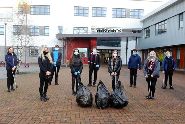 Falkirk High School's Pupil Junior Management Team display the results of their litter pick. Picture: Michael Gillen.