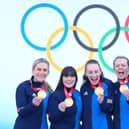 BEIJING, CHINA - FEBRUARY 20: (L-R) Curlers Milli Smith, Hailey Duff, Jennifer Dodds, Vicky Wright and Eve Muirhead of Team Great Britain pose for pictures with their gold medals after winning the  Women's Curling final against Team Japan  at National Aquatics Centre on February 20, 2022 in Beijing, China. (Photo by Lintao Zhang/Getty Images)