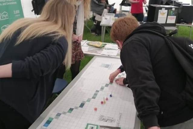 Pupils get to grips with the Grangemouth Flood Protection Scheme interactive board game
(Picture: Submitted)