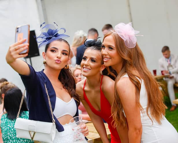 Friends Jenna, Roxane and Ellie capture the day in the first of many selfies