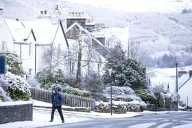 A man walks through the snow in Killin, Stirlingshire