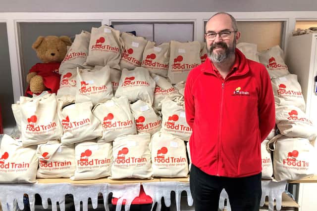 Food Train support worker Dan Hanely with the winter warmer packs. Pic: Contrbuted