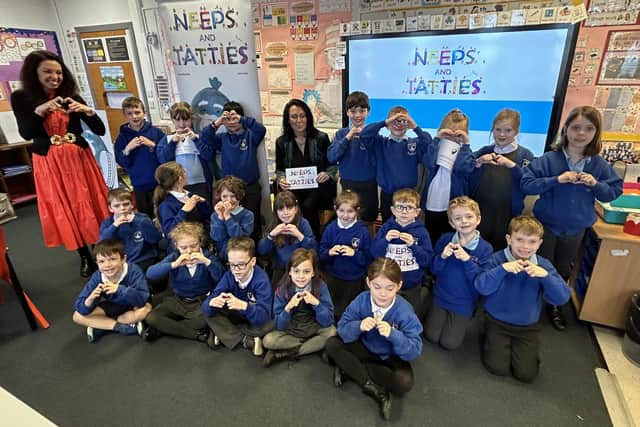 Minister Siobhian Brown visited the school to toasts Neeps & Tatties book being used in over 1000 primary schools since January 2021.
