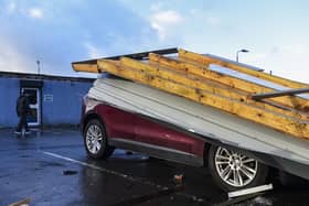 Damage to a car on Burnbank Road parked at Gambero Rosso restaurant after the roof came off nearby hairdresser's Lox. Pic: Lisa Ferguson