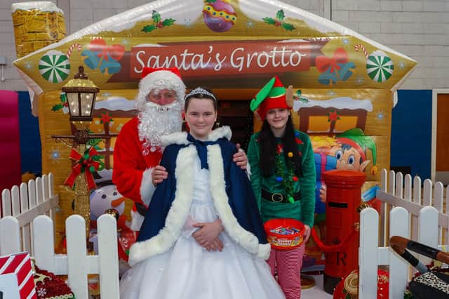 Santa with Bonnybridge Gala Queen Skye McMenemy, 11,  and Kayla the elf, 12
