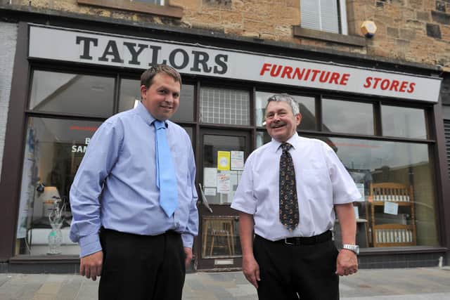 Taylor's Furniture Stores  in Falkirk's Manor Street is celebrating 100 years in business in 2021. Pictured are son Lawrence and dad Raymond Taylor. Picture: Michael Gillen.