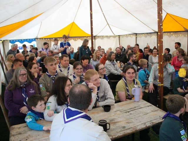 Everyone gathers in the tent on the first evening to hear all about the weekend.