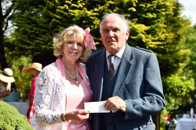 Jane, the Lady Westerlea, presenting a cheque to Pat Reid for Forth Valley Sensory Centre