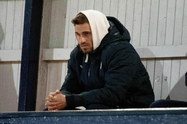 David Goodwillie watches Raith Rovers and Queen of the South play at Stark's Park