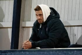 David Goodwillie watches Raith Rovers and Queen of the South play at Stark's Park