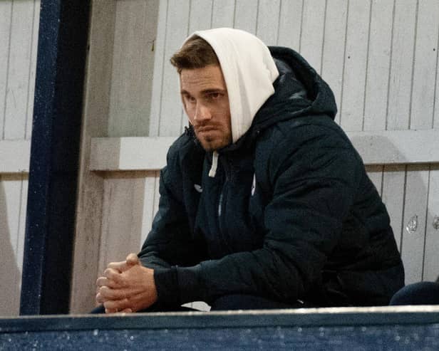 David Goodwillie watches Raith Rovers and Queen of the South play at Stark's Park