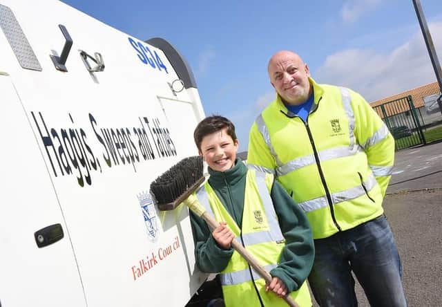 Archie, from St Margaret's Primary, came up with the overall winning name Haggis, Sweeps and Tatties. He's pictured with Gordon Ross, from Falkirk Council.