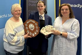 Lynne Reid, RHET Forth Valley chairperson and Louise Harley, of Hamlyns of Scotland,  present Larbert High School pupil Millie Ritchie with her prize (Picture: Submitted)