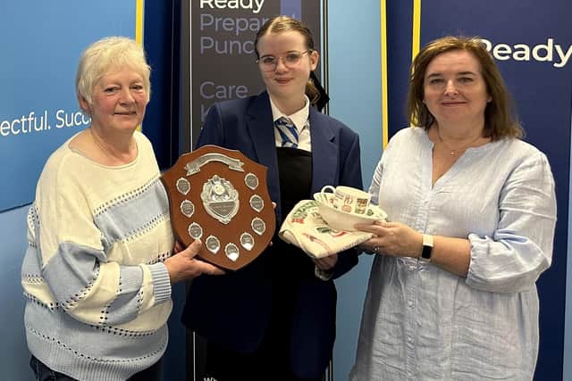 Lynne Reid, RHET Forth Valley chairperson and Louise Harley, of Hamlyns of Scotland, present Larbert High School pupil Millie Ritchie with her prize (Picture: Submitted)