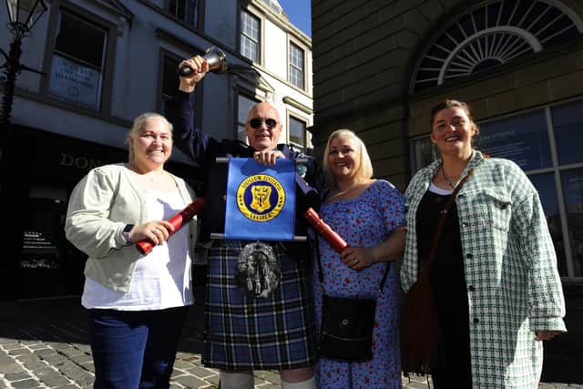 Town Crier Philip de la Maziere making a special surprise proclamation to mark the 40th birthday of twin sisters Suzie Learmonth and Pamela Gracie.  Carol Crawford (their sister, right) is also pictured.