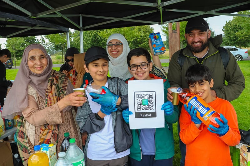 Rafia, Ayub, 10, Hamid, 13, and Mahad, 10, with at the back Farah and Aamer - all The Drink Stand where the children were encouraged to creat e a means to earn money and devised the QR code system to link to Paypal for members of the public to pay for drinks.