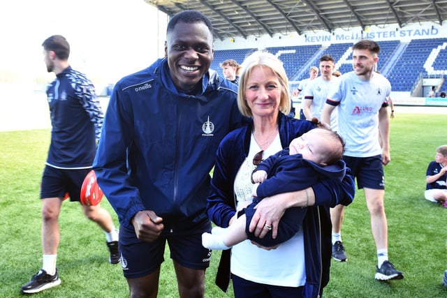 Falkirk winger Alfredo Agyeman with new tot Junior Bairn member and namesake Alfie