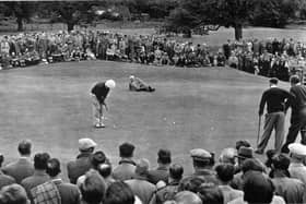 Bobby Locke watches John Panton hole out at the 15th  at Glenbervie.  The man lying down is the referee. Pic: Contributed